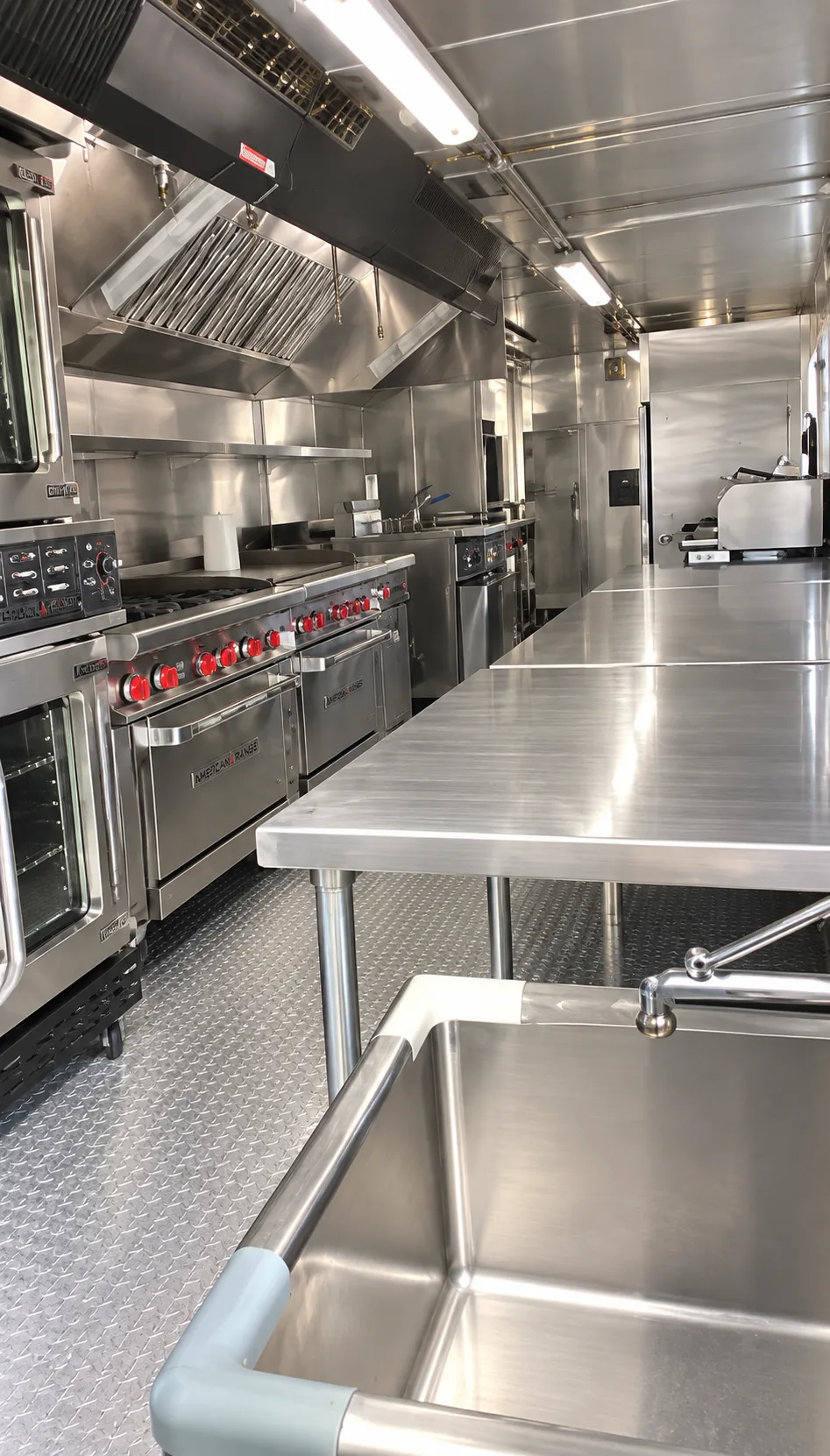Commercial cooking equipment and preparation space inside a Temporary Kitchen Rental trailer